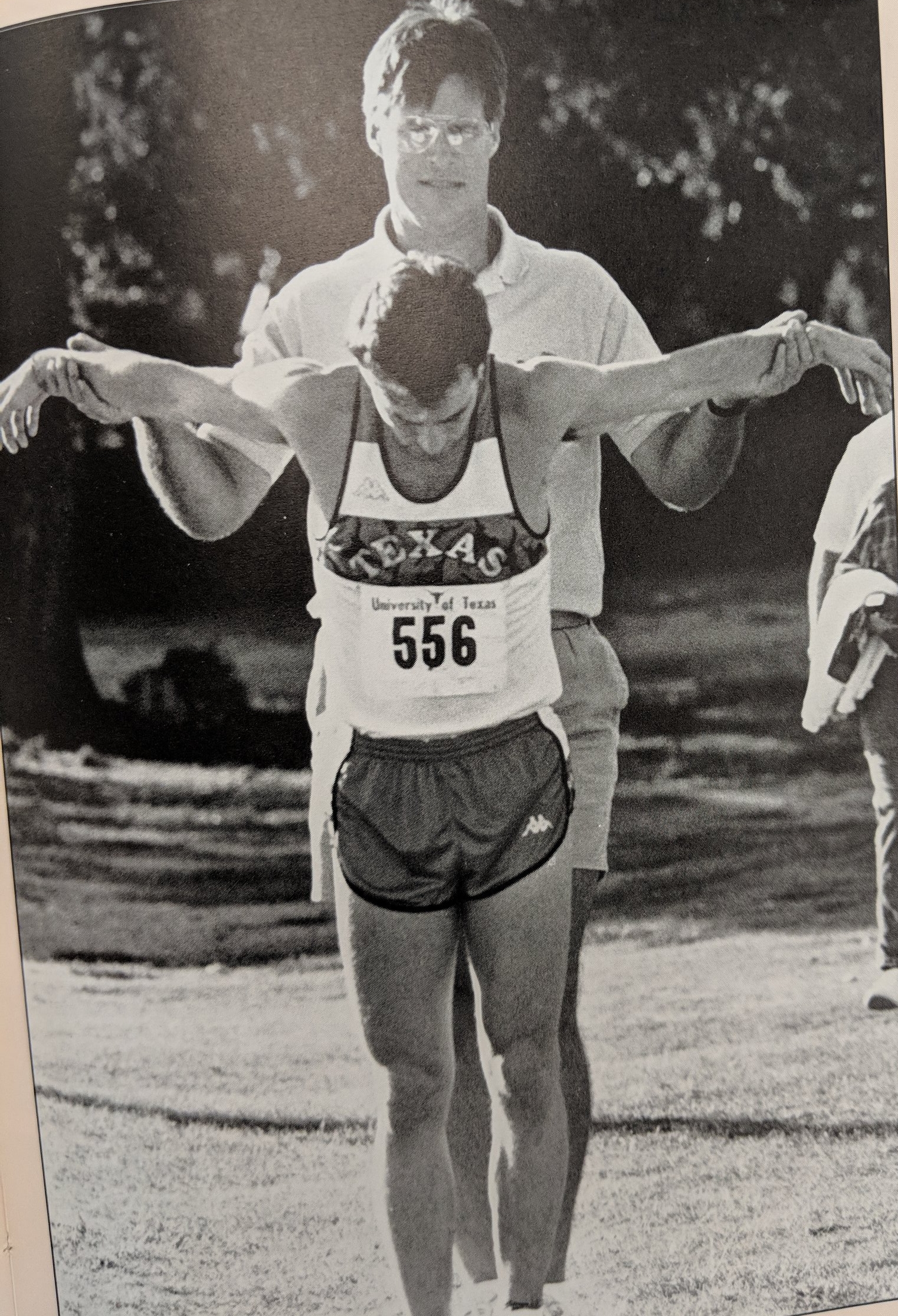 Trainer helping athlete