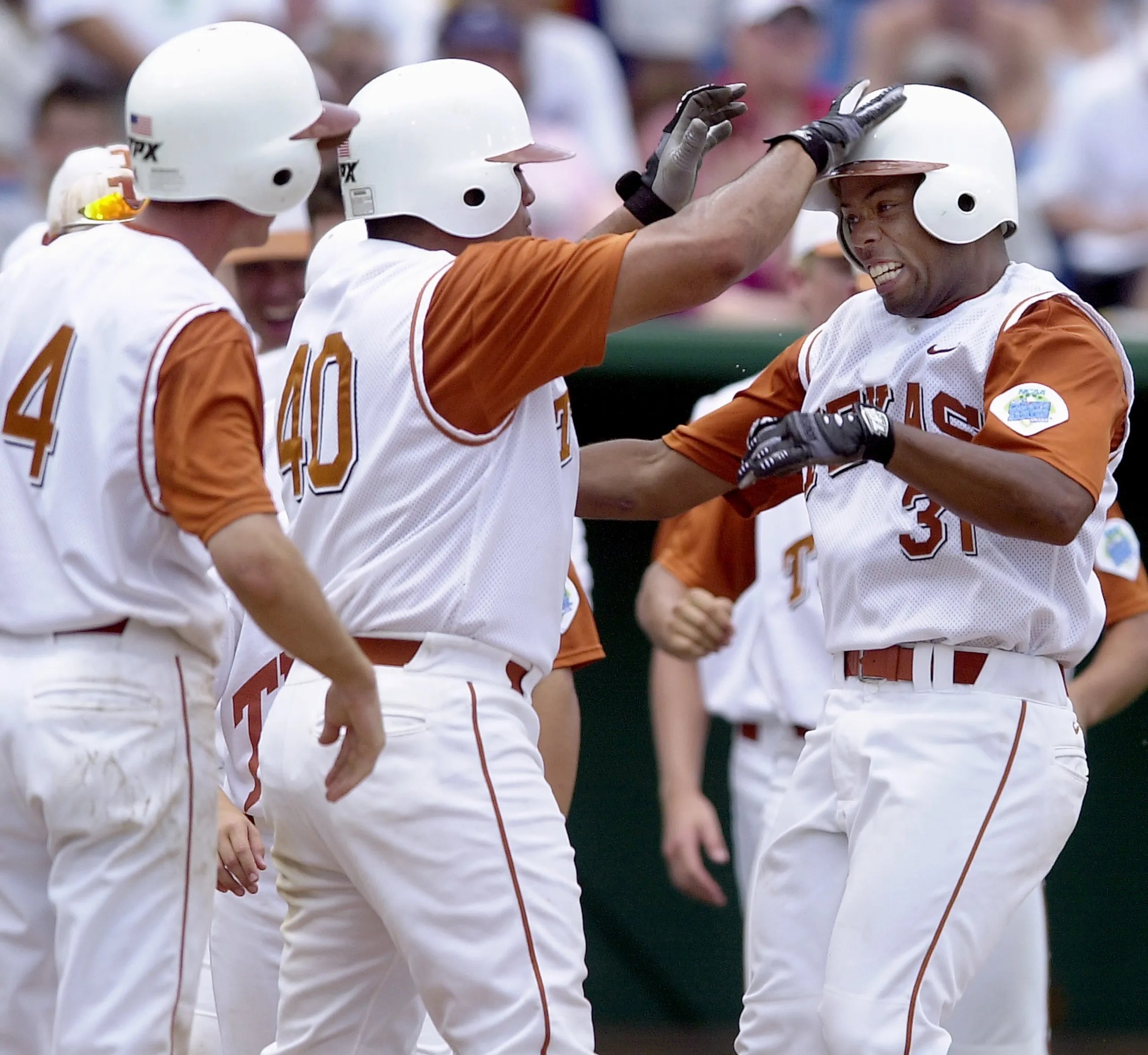 2002 #40 Jeff Ontiveros celebrates #31 Chris Carmichaels home run against South Carolina