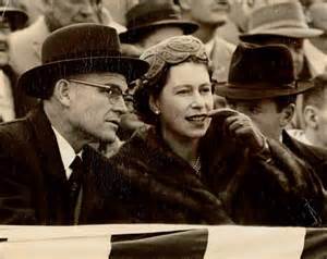 President Elkins escorts the crowned Queen Elizabeth