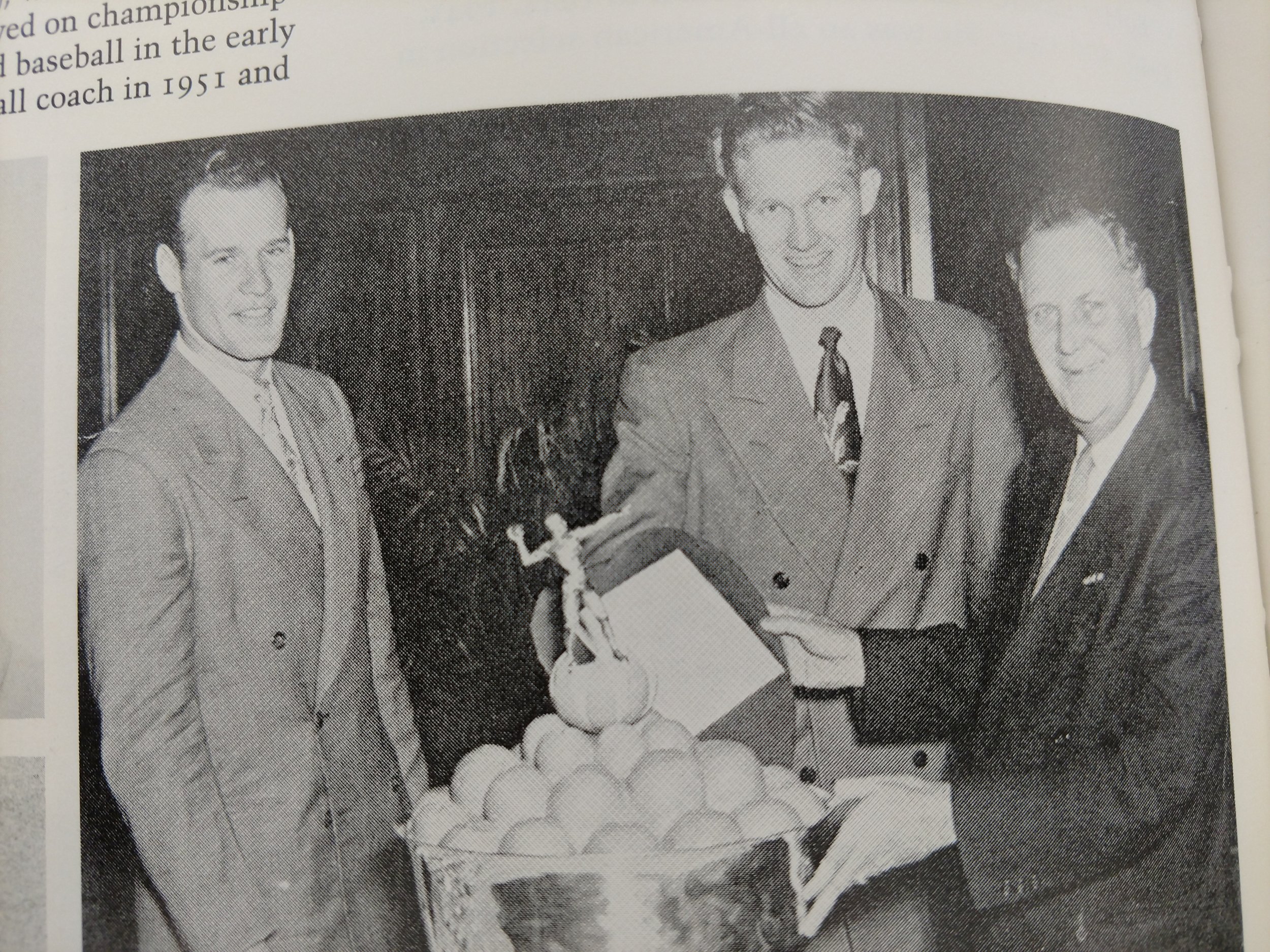 Landry and Dick Harris receive orange bowl trophy from Gov. Beauford Jester.jpg