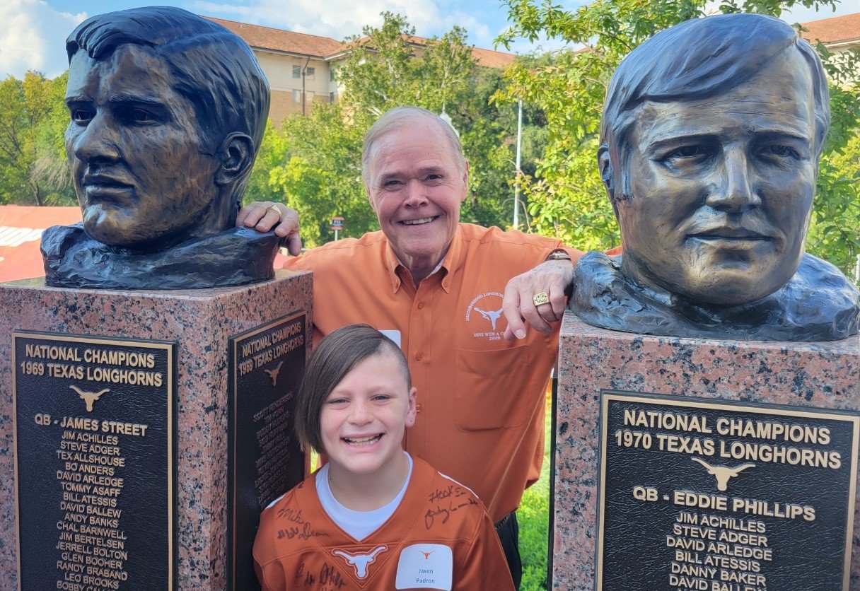  Billy Dale and grandson Jaxen  between bust of James and Eddie 